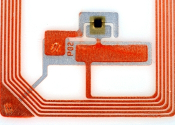 Close up pictures of a RFID tag showing the chip and antennas