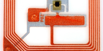 Close up pictures of a RFID tag showing the chip and antennas