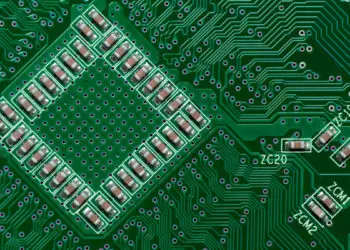 Ceramic Capacitors on Green Digital electronic circuit board texture pattern background