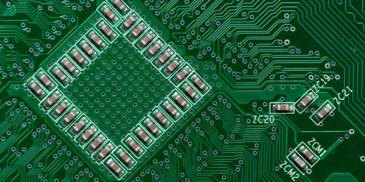 Ceramic Capacitors on Green Digital electronic circuit board texture pattern background