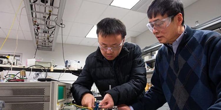 Xin Chen, a doctorate candidate in the Department of Materials Sciences and Engineering at Penn State, and Qiming Zhang, distinguished professor of electrical engineering, test a film capacitor.
IMAGE: Penn State College of Engineering