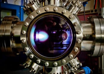 To make the new material, the thin film is first deposited via a pulsed-laser deposition process in this chamber. The bright “plume” you see is the laser hitting the target and depositing the material. (Image courtesy of Lane Martin)