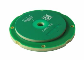 Compact inductive rotary position encoder sensor near a motor shaft, representing the Vishay RAIK045I MP encoder category