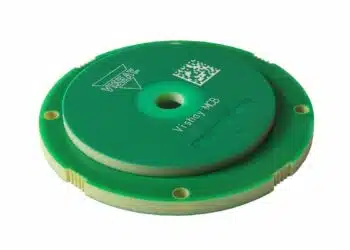 Compact inductive rotary position encoder sensor near a motor shaft, representing the Vishay RAIK045I MP encoder category