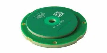 Compact inductive rotary position encoder sensor near a motor shaft, representing the Vishay RAIK045I MP encoder category