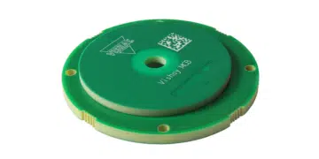 Compact inductive rotary position encoder sensor near a motor shaft, representing the Vishay RAIK045I MP encoder category