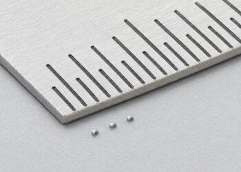 Conceptual illustration of a Murata NCU01 surface-mount NTC thermistor beside densely arranged electronic components