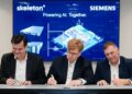 Siemens executives Markus Grabmeier and Barry Powell with Skeleton Technologies CEO Taavi Madiberk at the investment announcement