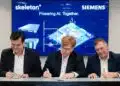 Siemens executives Markus Grabmeier and Barry Powell with Skeleton Technologies CEO Taavi Madiberk at the investment announcement