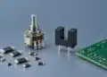 Concept illustration of TT Electronics resistor and sensing technologies with chip resistors, a shaft potentiometer and a slotted optical sensor
